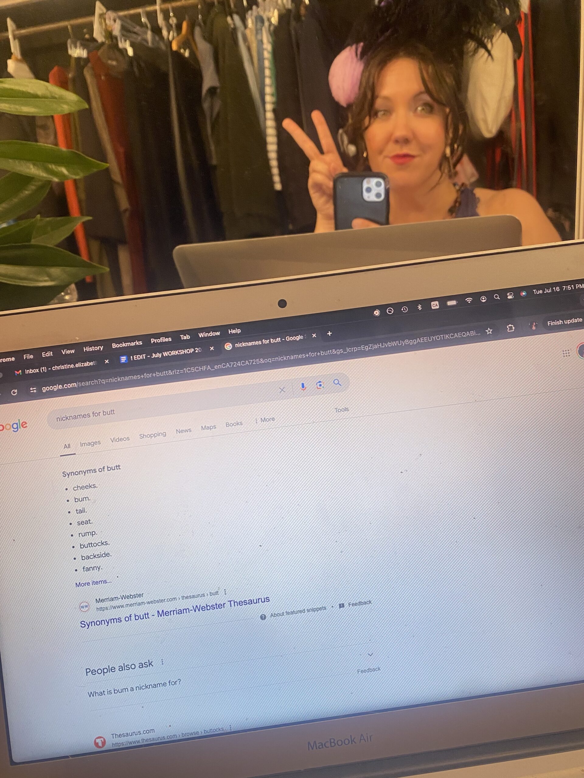 Christine Quintana takes a mirror selfie backstage, dressed as Madame Mystique in Twelfth Night. On her laptop screen, we see her Googling "nicknames for butt."