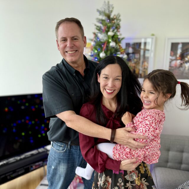 Claire Sakaki and her family posing for a photo.